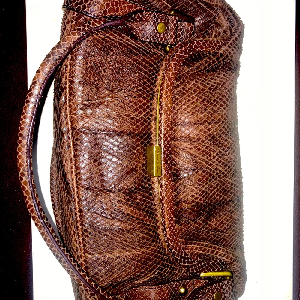 never used, really beautiful brown leather.